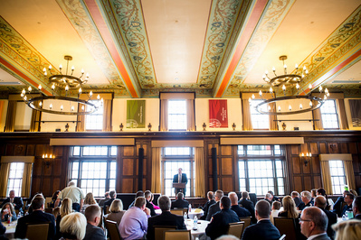 A police graduation is happening in one of the old historic rooms in the Memorial Union on the campus of the UW Madison. 