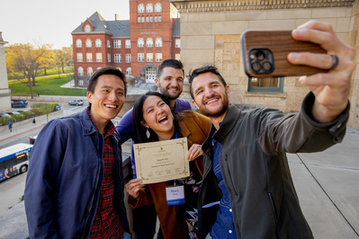 A group of students take a selfie at an event at the UW Madison at the Memorial Union. 