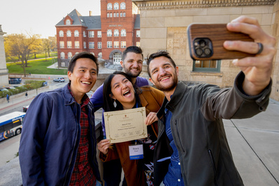 A group of students take a selfie at an event at the UW Madison at the Memorial Union. 