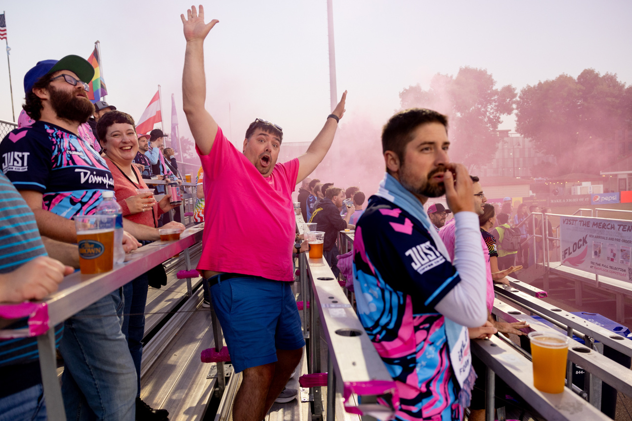 Freelance photographer captures a joyous moment of celebration as a sports fan cheers on their team. Forward Madison FC, Breese Stevens Field, Madison, WI.