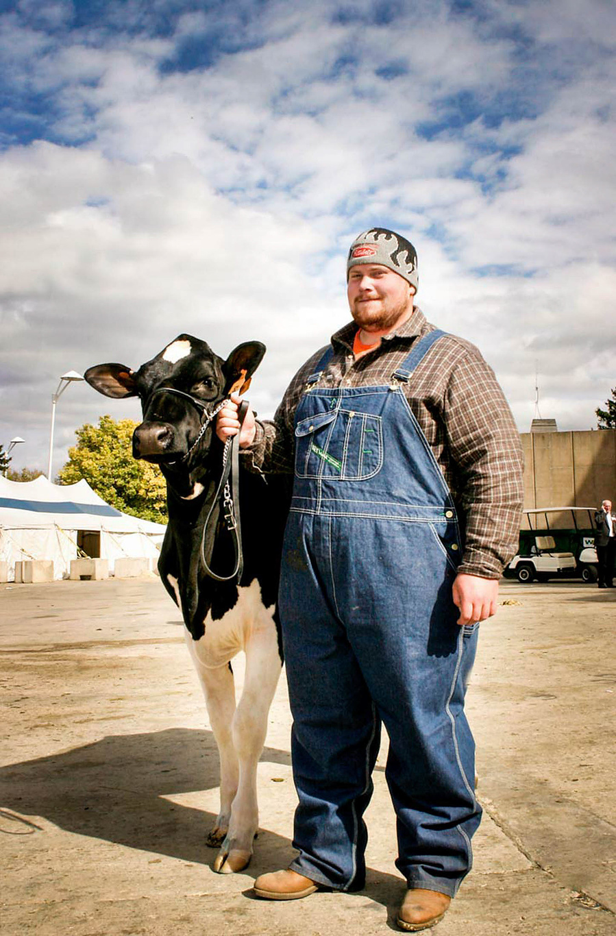A man poses with his cow at the World Dairy Expo in Madison, WI. 