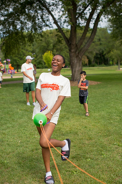 A kid is having fun at a boys and girls camp in Middleton, WI. 