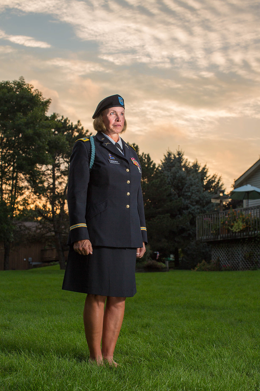 A transgender gal is part of the navy army government something and she is posed looking real serious. 