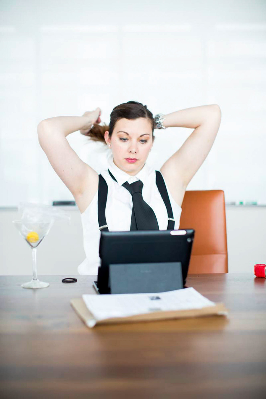 A gal working in front of her computer is dressed up a like a guy as  a  cause maybe she'd be farther along is she were a guy. All I'm saying is we did this photoshoot wayyyyyy before that Taylor Swift song. 