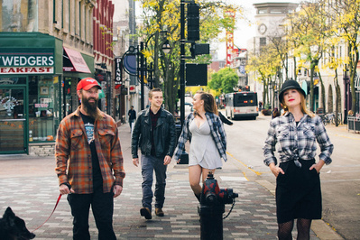family documentary photo of a family walking along state street in madison wisconsin