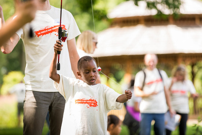 A kid is fishing at a boys and girls camp in Middleton, Wi. 