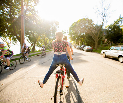 a biking photo of a family riding in summertime in madison, wisconsin