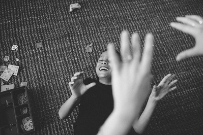 laughter and joy shine through this photo of siblings playing together.