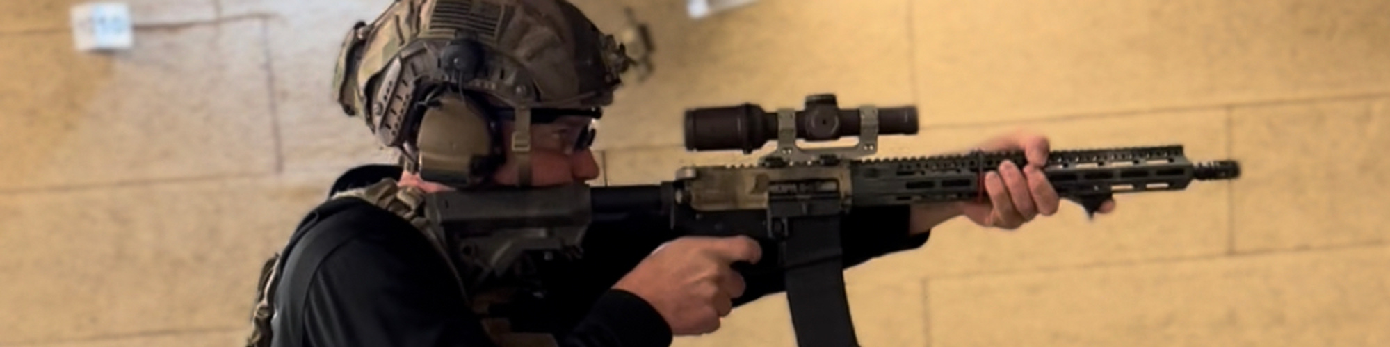 An impactful, high-resolution image capturing a controlled training environment. Picture dedicated professionals coaching students in safe firearm handling or individuals practicing shooting techniques at a modern, well-equipped range.