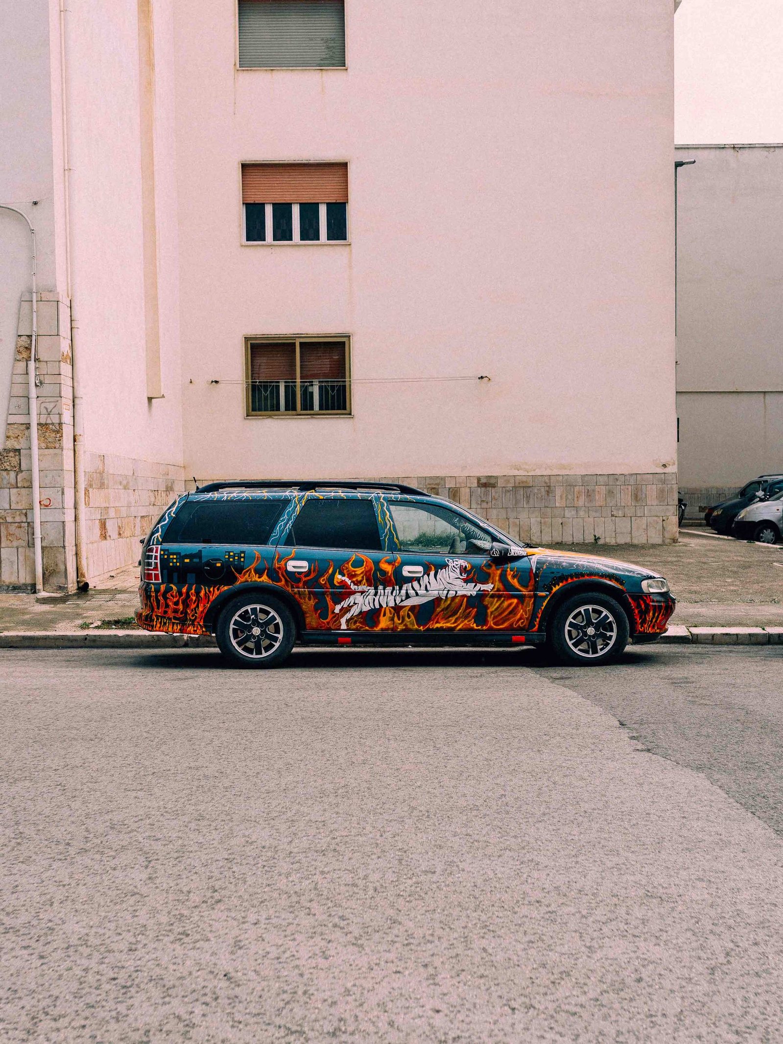 Customized car with flames and white tiger details