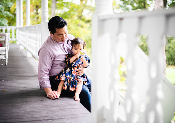 Father and Daughter taking it easy on the porch. Enjoying the quiet of the countryside. 