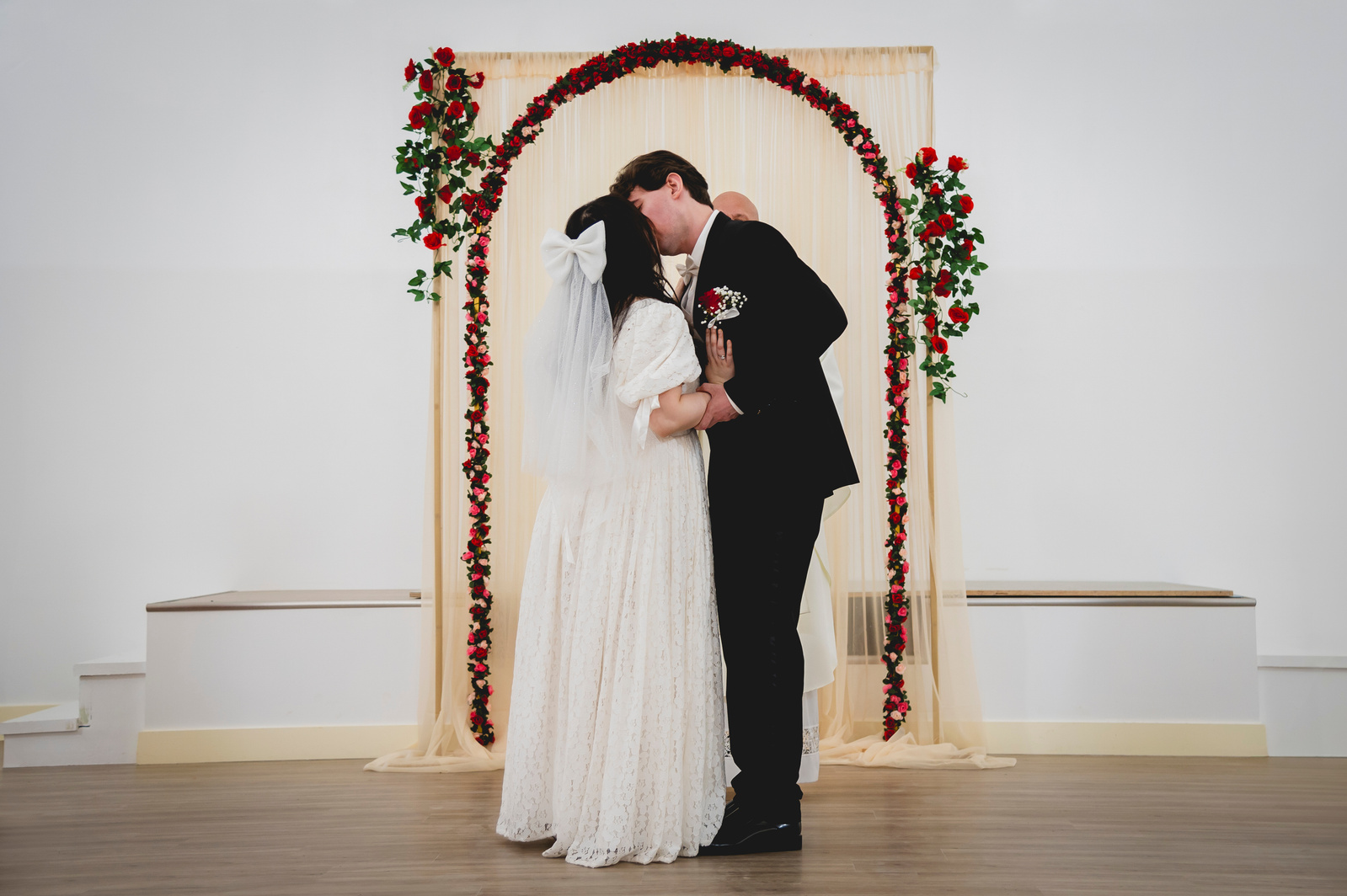 Bride and Grooming kissing when the priest said 