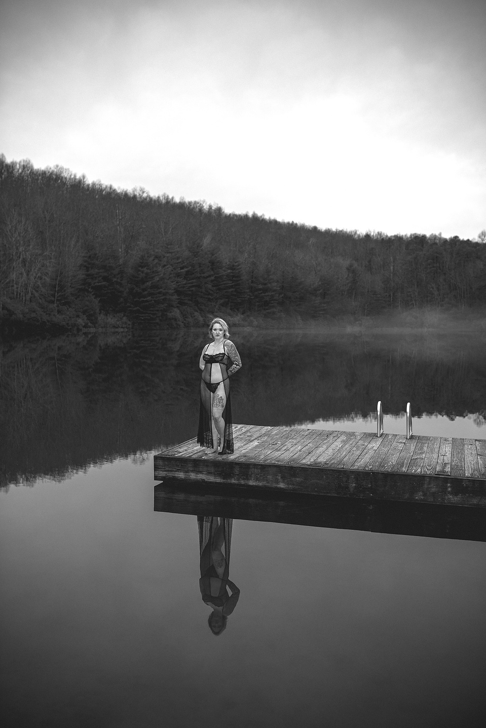 Black-and-white photo from an outdoor boudoir photography session at a lake in DuPont Forest near Asheville, NC