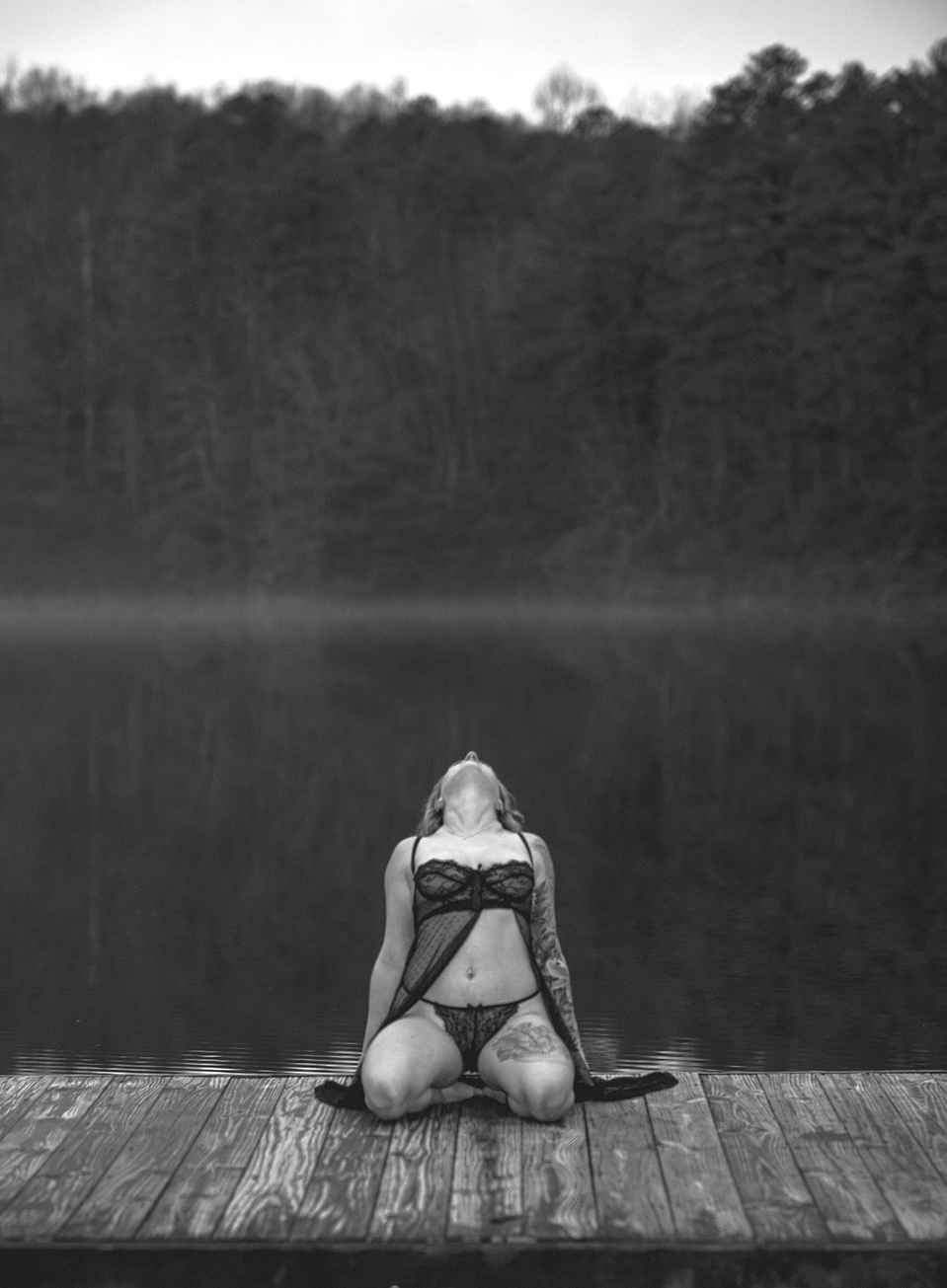 Black-and-white photo from an outdoor boudoir photography session at a lake in DuPont Forest near Asheville, NC