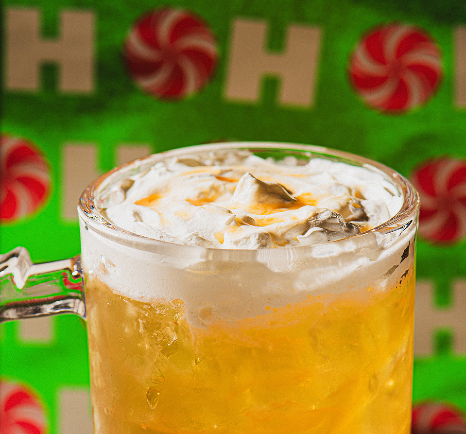 A close up photo of a butter beer at Asheville's Pillar Rooftop Bar