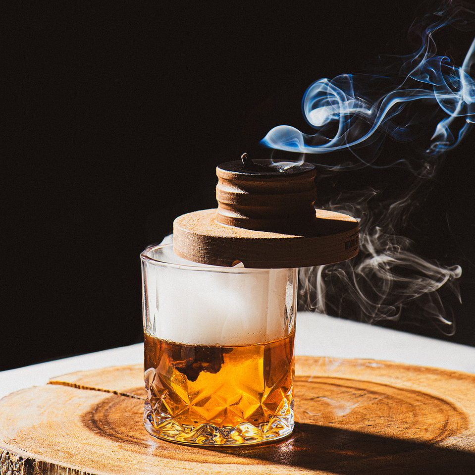 A smoked whiskey cocktail photo at Pillar Bar, a rooftop bar in Asheville, NC