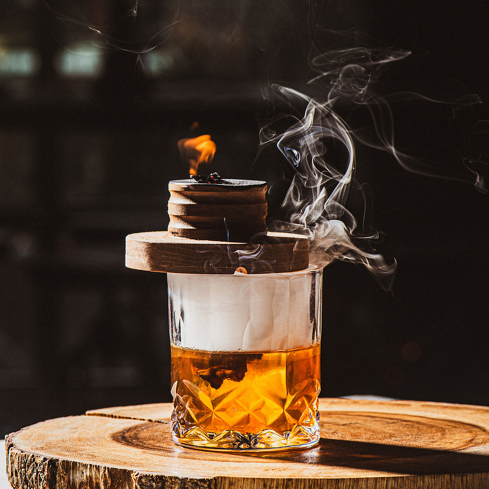 A smoked whiskey cocktail photo at Pillar Bar, a rooftop bar in Asheville, NC