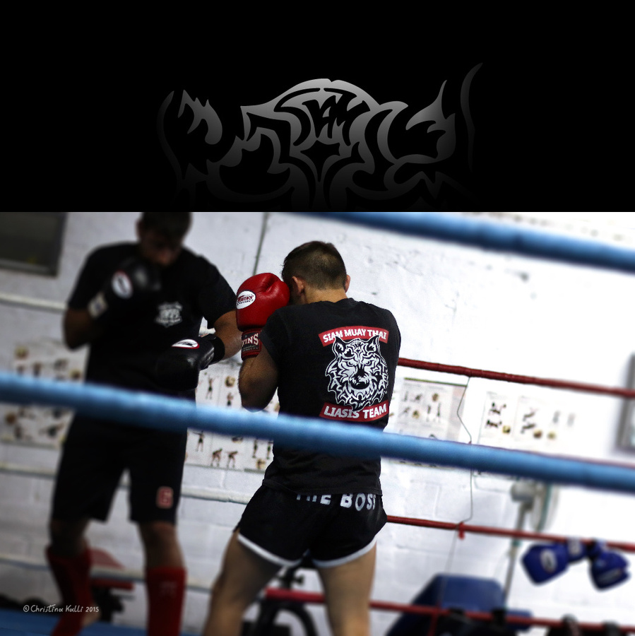 Muay Thai fighters spar in the ring wearing t-shirts with the logos of Siam Muay Thai Liasis Team, a Muay Thai school of martial arts in Cyprus.