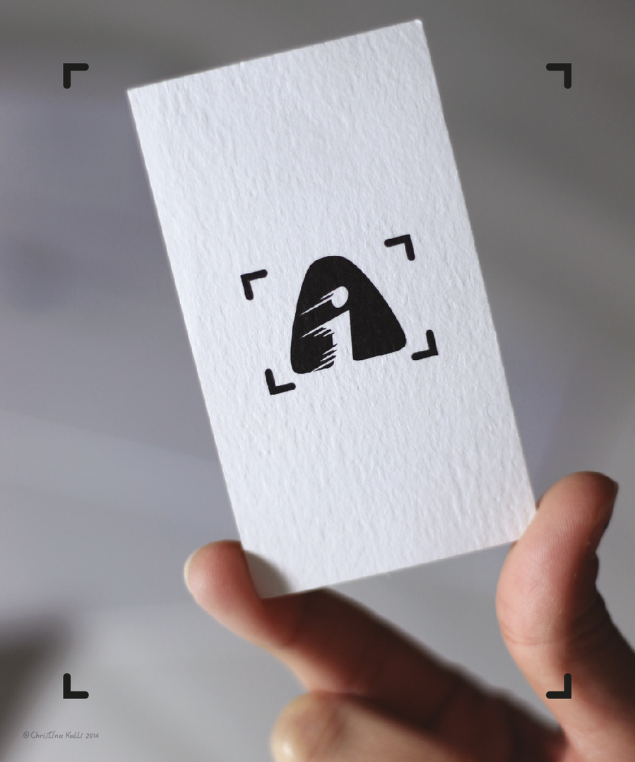 Business card design featuring the logo design for Action Images by Andreas Iacovou, a sports photographer, with his initials A and I interacting to resemble a runner with speed lines.