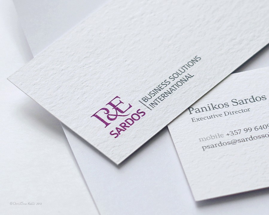 A close-up of business card design as part of the branding identity for P&E Sardos, a business consulting company.