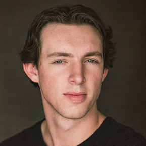 Headshot of a male Brisbane actor on a dark background