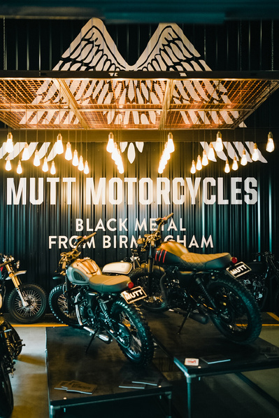 Inside Mutt Motorcycles garage in Birmingham with motorbikes on display