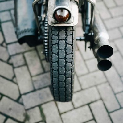 rear tire of a custom harley davidson chopper photographed at mutt motorcycles HQ in birmingham uk. Shot by Rob Senior.