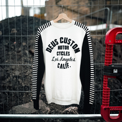 Deus Ex Machina Custom motorcycle brand jumper in an urban environment on a hanger. Shot by Rob Senior Edinburgh based photographer