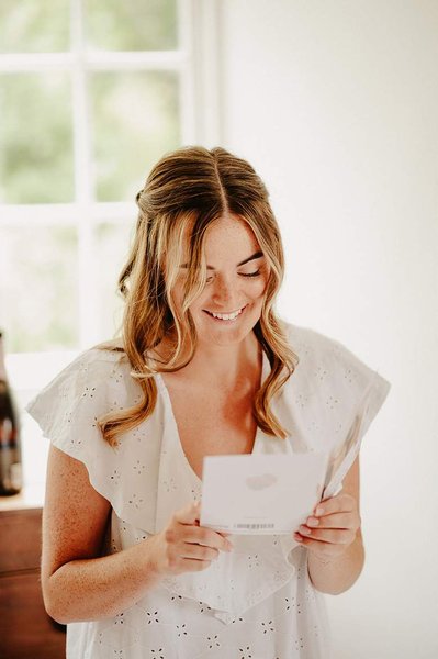 Bride being emotional reading a letter
