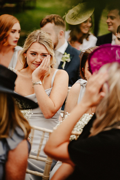 Bridesmaid being emotional and sobbing during ceremony