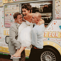 a  bride is being carried out of an ice cream van during relaxed kent wedding day