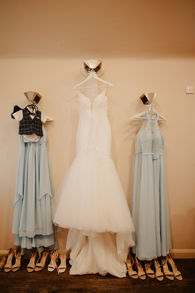 Bridesmaid and bridal dress hanging at the winters Barns