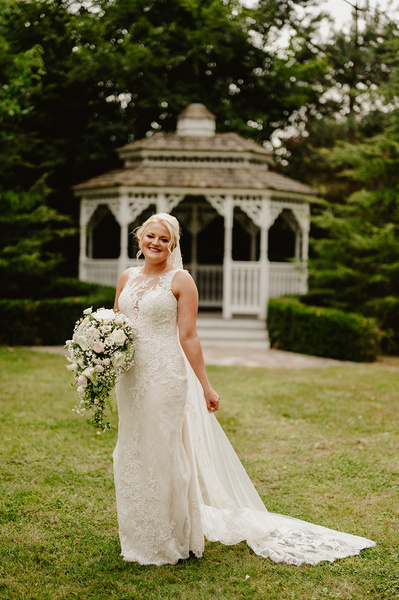 A portrait of a stunning bride outside at Marleybrook House