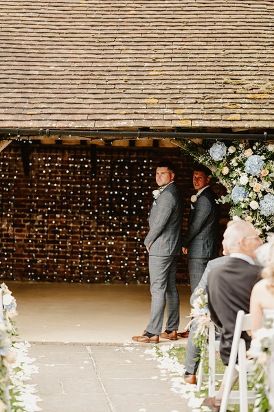 groom awaiting his bride in the outdoor ceremony area at winters barns