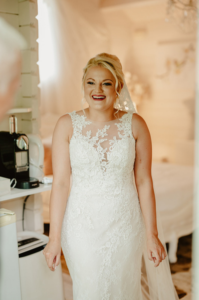 bride smiling in her wedding dress at the Kent wedding venue Marleybrook House