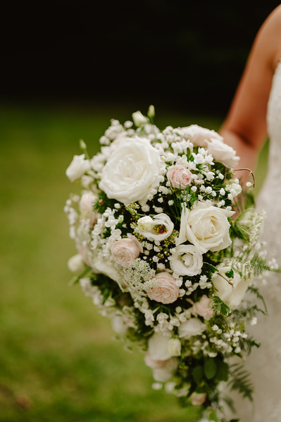 bride holding her bouquet in the outdoors at Marleybrook house