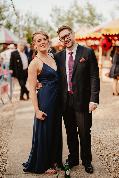 Relaxed photo of wedding guests at Marleybrook House in the funfair