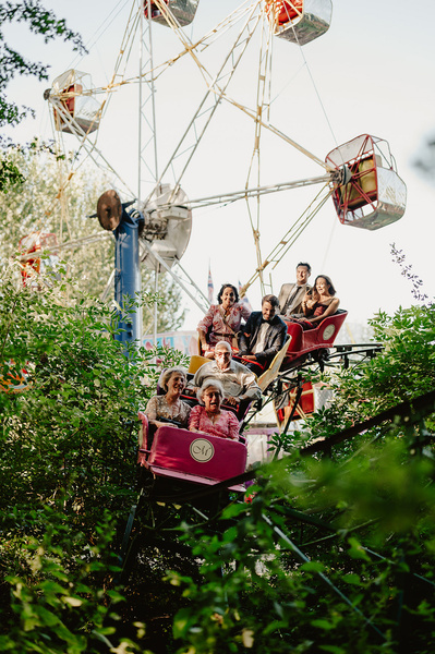 Wedding guests enjoying the funfair whilst riding a rollercoaster at Marleybrook House