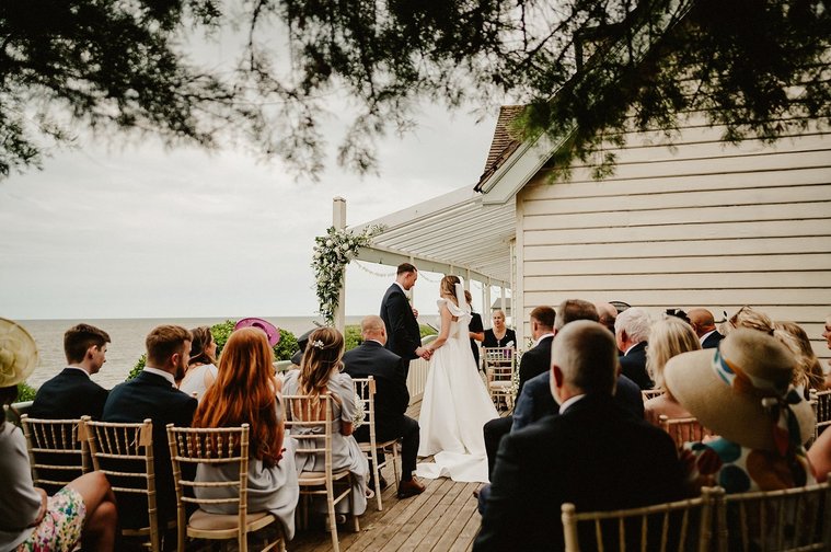 outdoor wedding ceremony at beacon house in kent