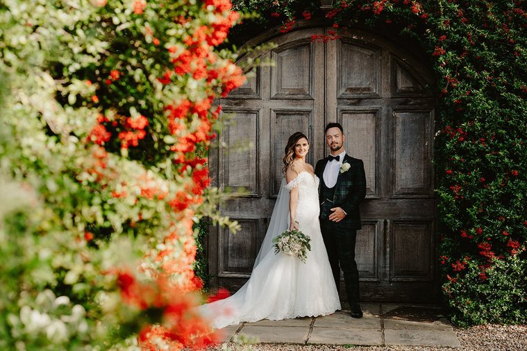 bride and groom unposed at winters barns during portrait shoot on their kent wedding day
