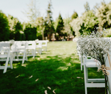 flowers on a chair in the outdoor ceremony area at pelham house