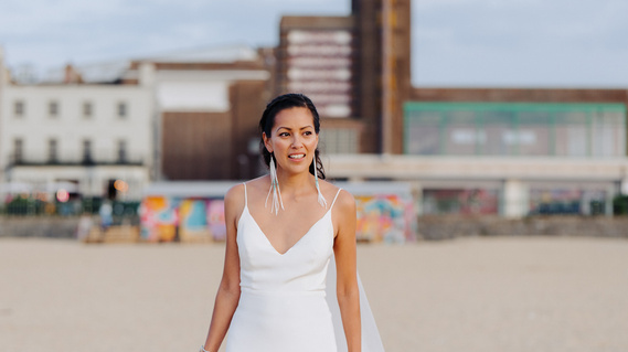 bride on her wedding day standing on margate beach