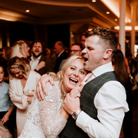 bride and groom having an amazing time on the dance floor during their wedding in kent