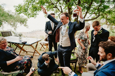 Groom defeats wedding guest at Jenga and is very happy