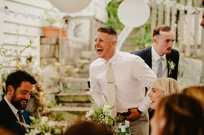 Wedding guest laughs uncontrollably during wedding reception at Beacon house Kent