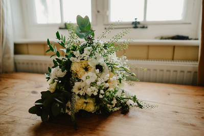 White floral bouquet lying on a table