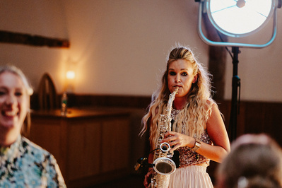 female sax player performing at winters barns