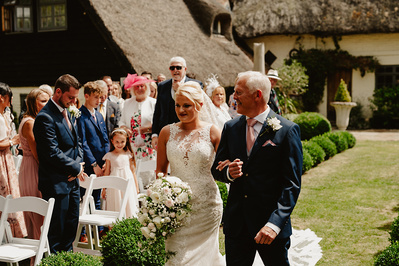Bride smiling next to her father at Marleybrook House