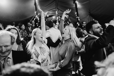 Black and white photo of the Dancefloor during a Indian garden wedding in Kent