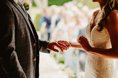 the ring exchange with a ring on a brides finger during ceremony at winters barns